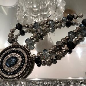 Vintage Silver and Blue Necklace with Faceted Beads and Circular Pendant